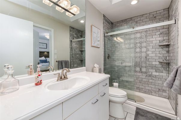 Bathroom, Dual Sink Vanities, Glass Shower, Interior, Recessed Lighting, Stone Walls