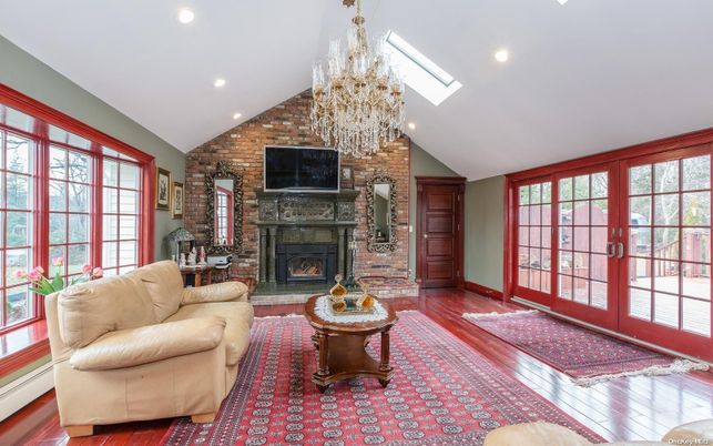 Chandelier, Fireplace, Interior, Living room, Recessed Lighting, Stone Walls, Wood Texture Flooring
