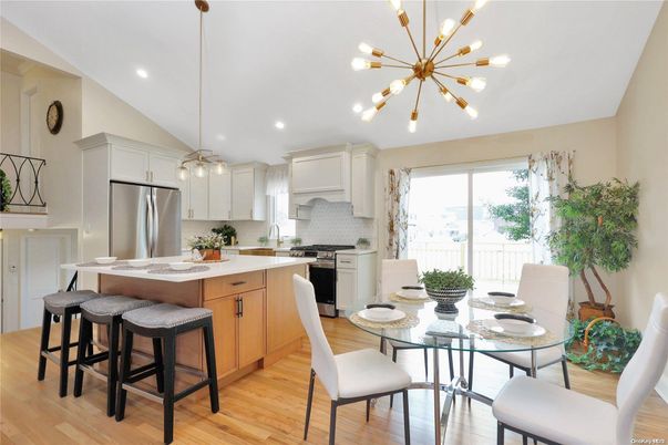 Dining room, Interior, Kitchen, Pendant Lights, Recessed Lighting, Stainless Steel Appliances, Wood Texture Flooring