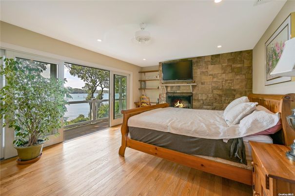 Bedroom, Fireplace, Interior, Recessed Lighting, Stone Walls, Wood Texture Flooring