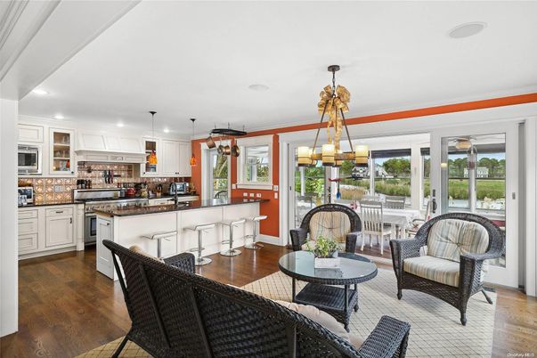 Chandelier, Dining room, Interior, Kitchen, Living room, Pendant Lights, Recessed Lighting, Stainless Steel Appliances, Wood Texture Flooring