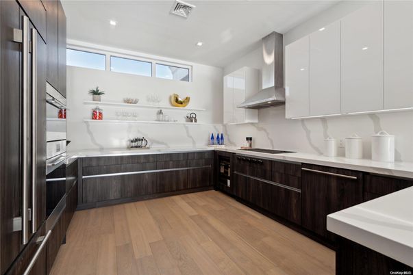 Interior, Kitchen, Marble Walls, Recessed Lighting, Stainless Steel Appliances, Wood Texture Flooring