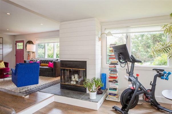 Fireplace, Fitness Equipment, Interior, Living room, Recessed Lighting, Wood Texture Flooring