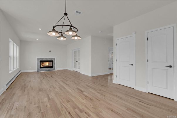 Empty room, Fireplace, Interior, Pendant Lights, Recessed Lighting, Wood Texture Flooring
