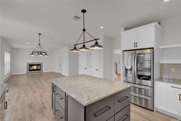 Fireplace, Interior, Kitchen, Pendant Lights, Recessed Lighting, Stainless Steel Appliances, Wood Texture Flooring