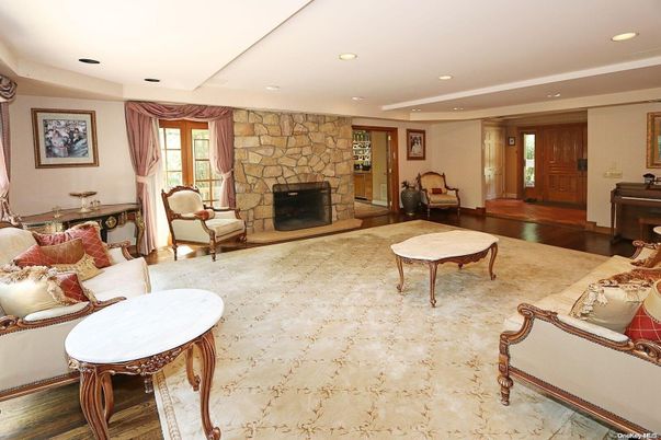 Fireplace, Interior, Living room, Recessed Lighting, Stone Walls, Wood Texture Flooring
