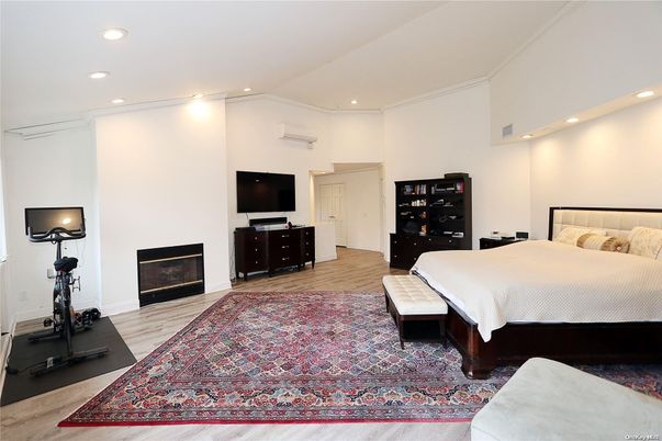 Bedroom, Fireplace, Fitness Equipment, Interior, Recessed Lighting, Wood Texture Flooring
