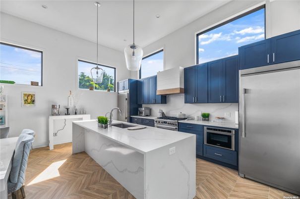 Interior, Kitchen, Marble Walls, Pendant Lights, Recessed Lighting, Stainless Steel Appliances, Wood Texture Flooring