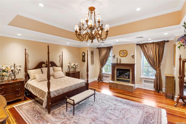 Bedroom, Chandelier, Fireplace, Interior, Recessed Lighting, Wood Texture Flooring