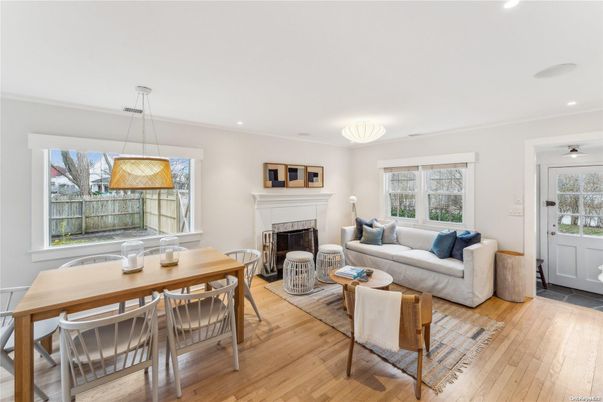 Dining room, Fireplace, Interior, Living room, Pendant Lights, Recessed Lighting, Wood Texture Flooring