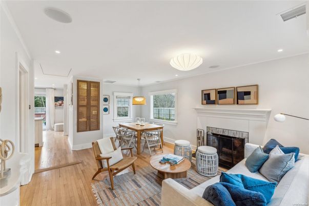 Dining room, Fireplace, Interior, Living room, Pendant Lights, Recessed Lighting, Wood Texture Flooring