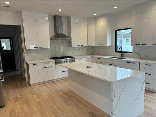 Interior, Kitchen, Marble Walls, Recessed Lighting, Stainless Steel Appliances, Wood Texture Flooring