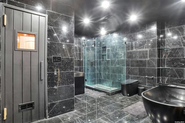Bathroom, Free Standing Baths, Glass Shower, Interior, Marble Walls, Recessed Lighting