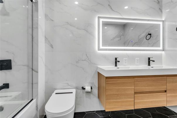 Bathroom, Dual Sink Vanities, Glass Shower, Interior, Marble Walls, Recessed Lighting