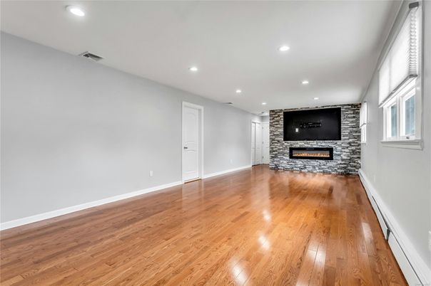 Empty room, Fireplace, Interior, Recessed Lighting, Wood Texture Flooring