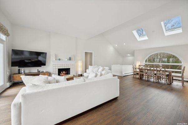 Dining room, Fireplace, Interior, Living room, Recessed Lighting, Wood Texture Flooring
