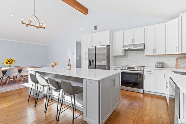 Dining room, Interior, Kitchen, Pendant Lights, Recessed Lighting, Stainless Steel Appliances, Wooden Beams, Wood Texture Flooring