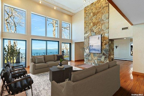 Fireplace, Interior, Living room, Recessed Lighting, Stone Walls, Water, Wood Texture Flooring