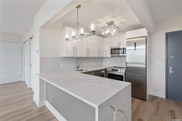 Interior, Kitchen, Marble Walls, Pendant Lights, Stainless Steel Appliances, Wood Texture Flooring
