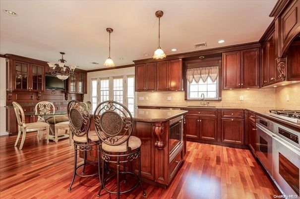 Chandelier, Dining room, Interior, Kitchen, Pendant Lights, Recessed Lighting, Stainless Steel Appliances, Wood Texture Flooring