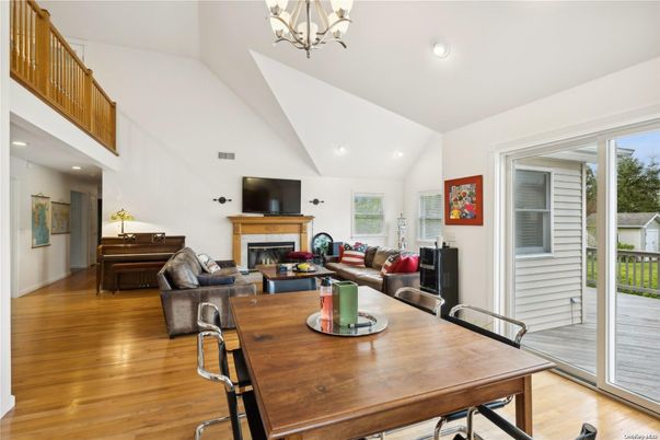 Chandelier, Dining room, Fireplace, Interior, Living room, Recessed Lighting, Wood Texture Flooring