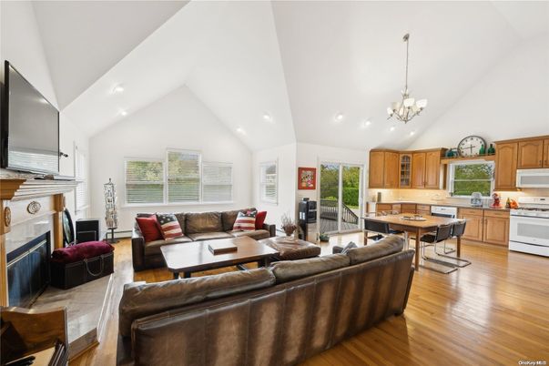 Chandelier, Dining room, Fireplace, Interior, Kitchen, Living room, Recessed Lighting, Wood Texture Flooring