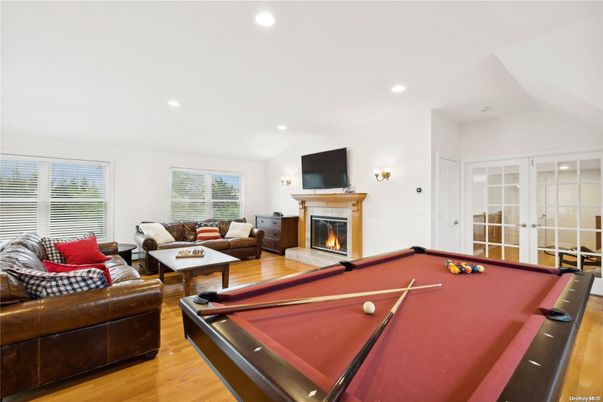Billiard Table, Fireplace, Game Room, Interior, Living room, Recessed Lighting, Wood Texture Flooring