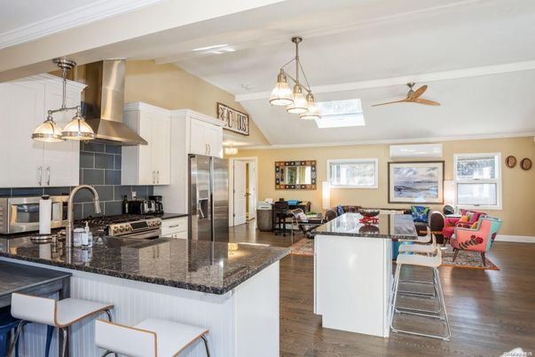 Chandelier, Dining room, Interior, Kitchen, Living room, Pendant Lights, Stainless Steel Appliances, Wood Texture Flooring
