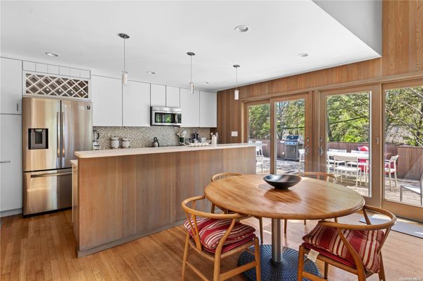 Dining room, Interior, Kitchen, Pendant Lights, Recessed Lighting, Stainless Steel Appliances, Wood Texture Flooring