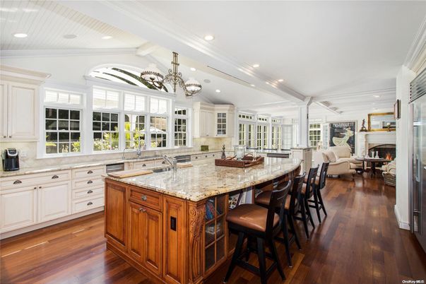 Chandelier, Fireplace, Interior, Kitchen, Living room, Recessed Lighting, Wood Texture Flooring
