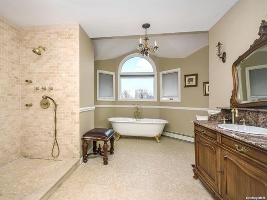 Bathroom, Chandelier, Dual Sink Vanities, Free Standing Baths, Interior, Stone Walls