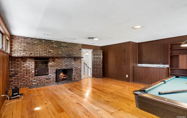 Billiard Table, Fireplace, Game Room, Interior, Recessed Lighting, Stone Walls, Wood Texture Flooring