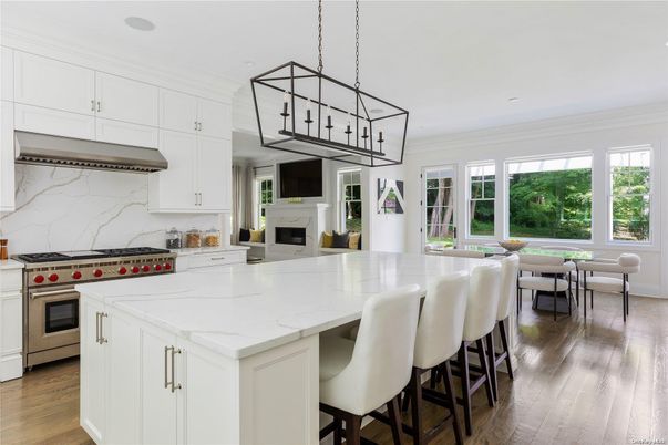 Dining room, Fireplace, Interior, Kitchen, Pendant Lights, Recessed Lighting, Stainless Steel Appliances, Wood Texture Flooring
