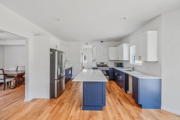 Dining room, Interior, Kitchen, Recessed Lighting, Stainless Steel Appliances, Wood Texture Flooring
