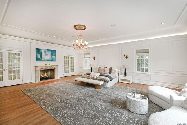 Bedroom, Chandelier, Fireplace, Interior, Living room, Recessed Lighting, Wood Texture Flooring