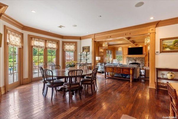 Chandelier, Dining room, Fireplace, Interior, Living room, Pendant Lights, Recessed Lighting, Wood Texture Flooring