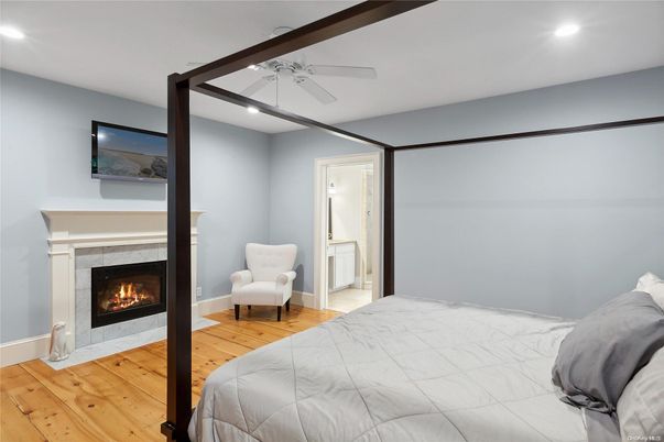 Bedroom, Fireplace, Interior, Recessed Lighting, Wood Texture Flooring