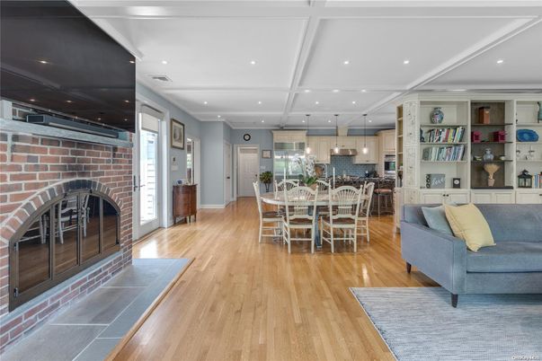 Dining room, Fireplace, Interior, Kitchen, Recessed Lighting, Stone Walls, Wood Texture Flooring
