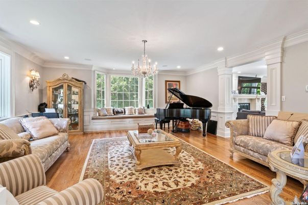 Chandelier, Fireplace, Interior, Living room, Piano, Recessed Lighting, Wood Texture Flooring