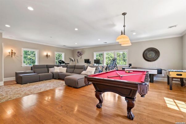 Billiard Table, Fitness Equipment, Game Room, Interior, Living room, Pendant Lights, Recessed Lighting, Wood Texture Flooring