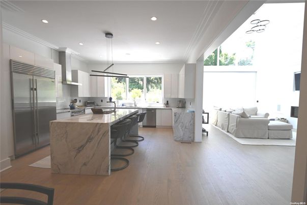 Interior, Kitchen, Living room, Marble Walls, Pendant Lights, Recessed Lighting, Stainless Steel Appliances, Wood Texture Flooring