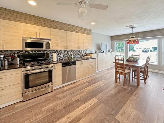 Dining room, Interior, Kitchen, Pendant Lights, Recessed Lighting, Stainless Steel Appliances, Wood Texture Flooring