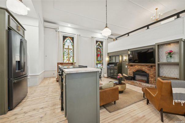 Chandelier, Fireplace, Interior, Kitchen, Living room, Pendant Lights, Recessed Lighting, Wood Texture Flooring
