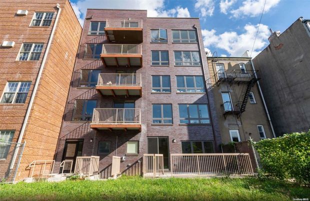 Exterior, Facade, Brick Facade, Condo Building