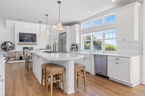 Dining room, Fireplace, Interior, Kitchen, Pendant Lights, Recessed Lighting, Stainless Steel Appliances, Wood Texture Flooring