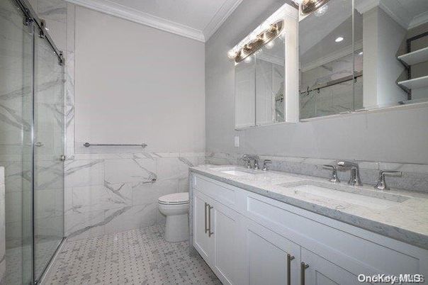 Bathroom, Dual Sink Vanities, Glass Shower, Interior, Marble Walls, Recessed Lighting