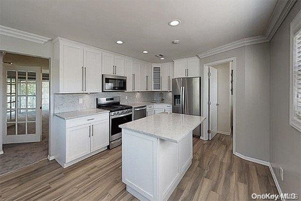 Interior, Kitchen, Recessed Lighting, Stainless Steel Appliances, Wood Texture Flooring
