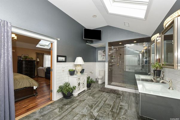 Bathroom, Dual Sink Vanities, Glass Shower, Interior, Recessed Lighting, Wood Texture Flooring