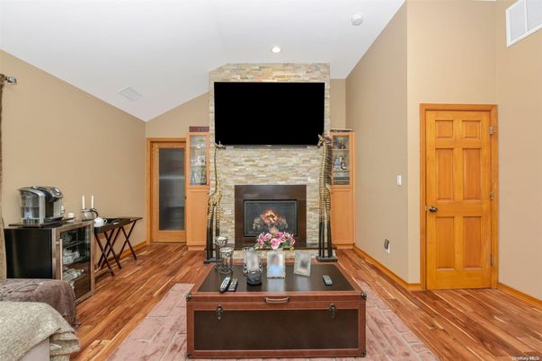 Dining room, Fireplace, Interior, Living room, Recessed Lighting, Wood Texture Flooring
