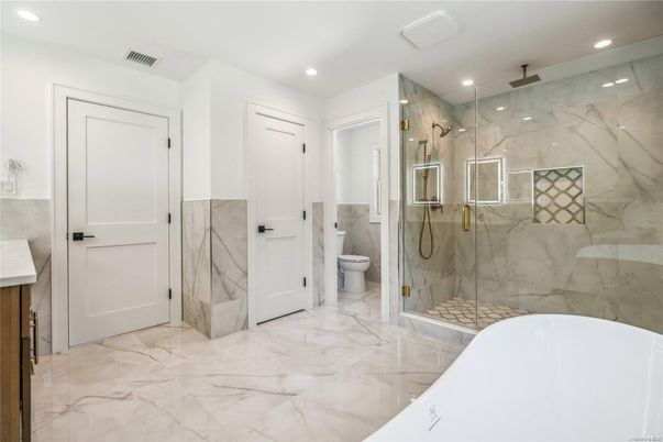 Bathroom, Free Standing Baths, Glass Shower, Interior, Marble, Marble Walls, Recessed Lighting